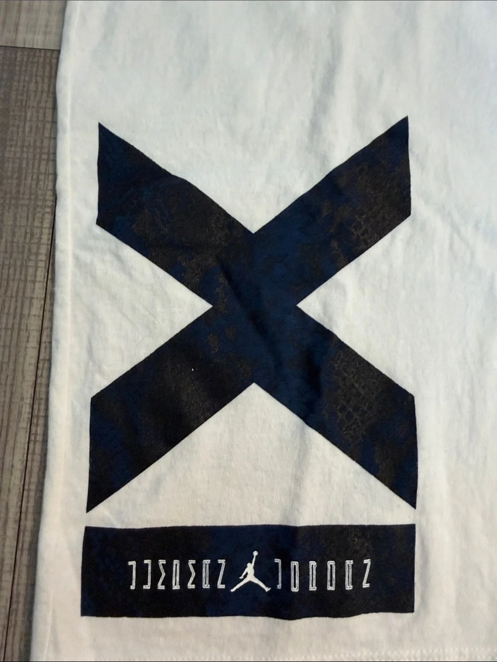 Jordan White Short Sleeve Tee with Black Graphic 'X' and Chest Stripes